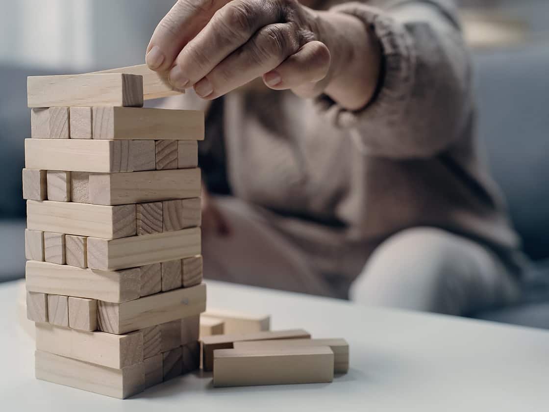 Photo of a senior working with building blocks