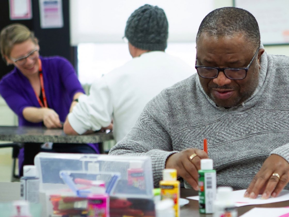 HIRO clients in residential home working with arts and crafts
